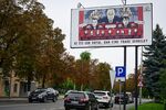 A billboard in Ungheni, Moldova, portrays a caricature of Vladimir Putin pulling the strings in the country’s upcoming election.