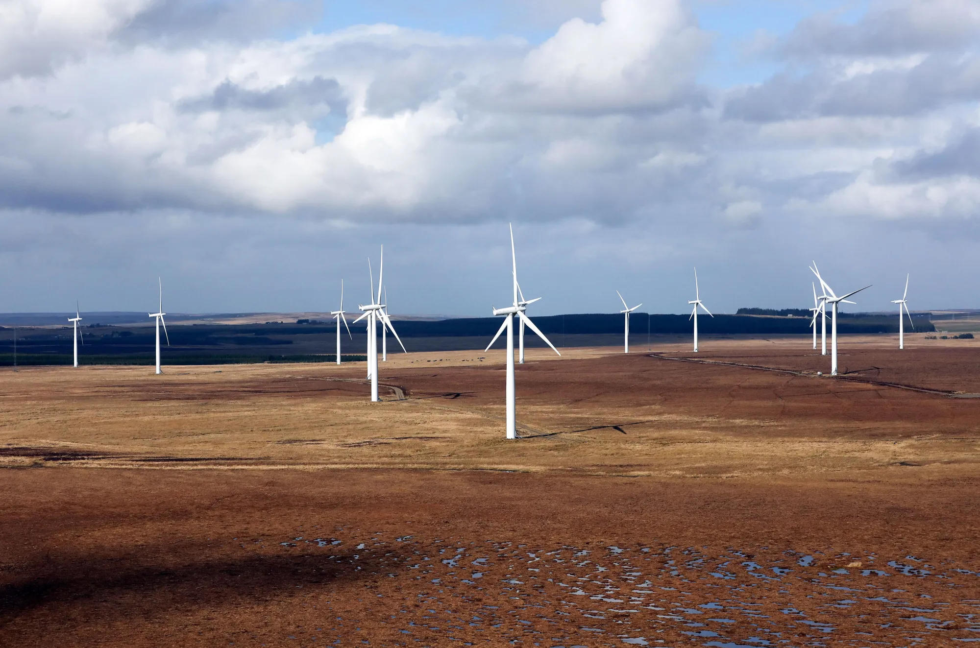 A wind farm stands in the Sutherland area of Scotland, U.K., on Wednesday, March 22, 2017. Generating power from new onshore wind farms would be 100 million pound a year cheaper than doing so from new nuclear reactors or biomass plants, and at least 30 million pounds cheaper than under the latest offshore wind-power contracts, according to research by the Energy & Climate Intelligence Unit, a London-based non-profit group.