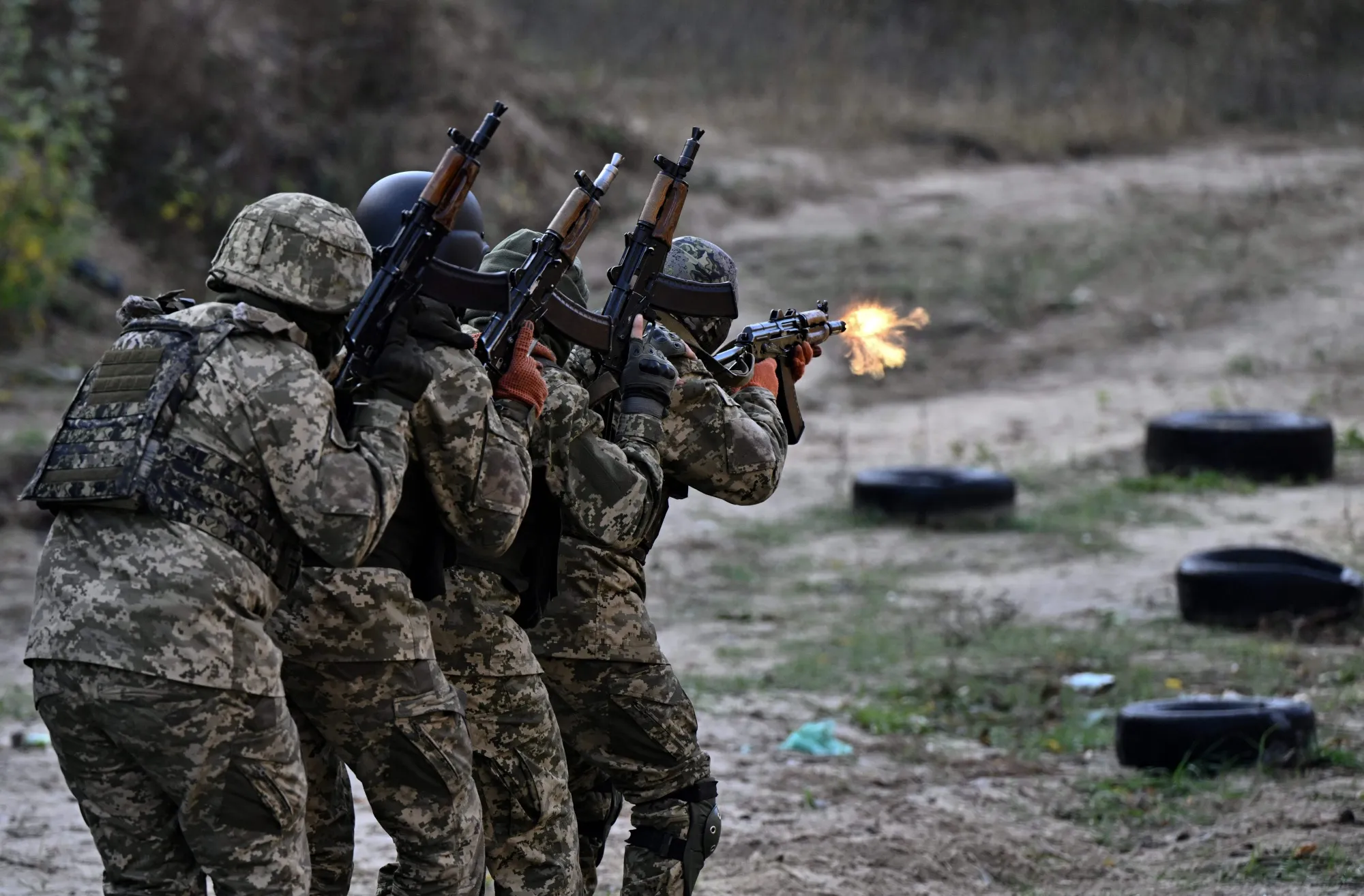 Members of the Ukrainian Armed Forces take part in a military training exercise outside Kyiv.