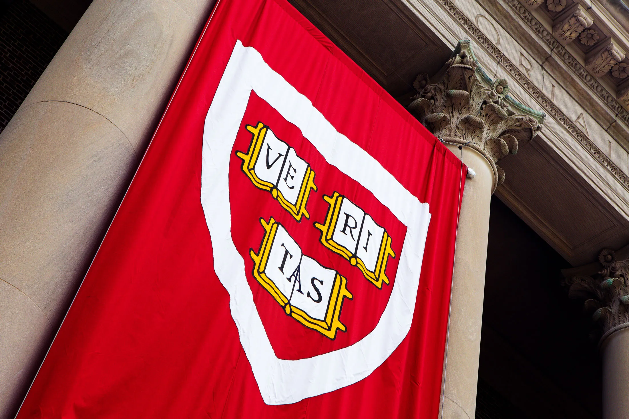 The Harvard’s Veritas shield logo.