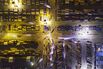 Light trails left by trucks run past containers at the Yangshan Deepwater Port, Shanghai.