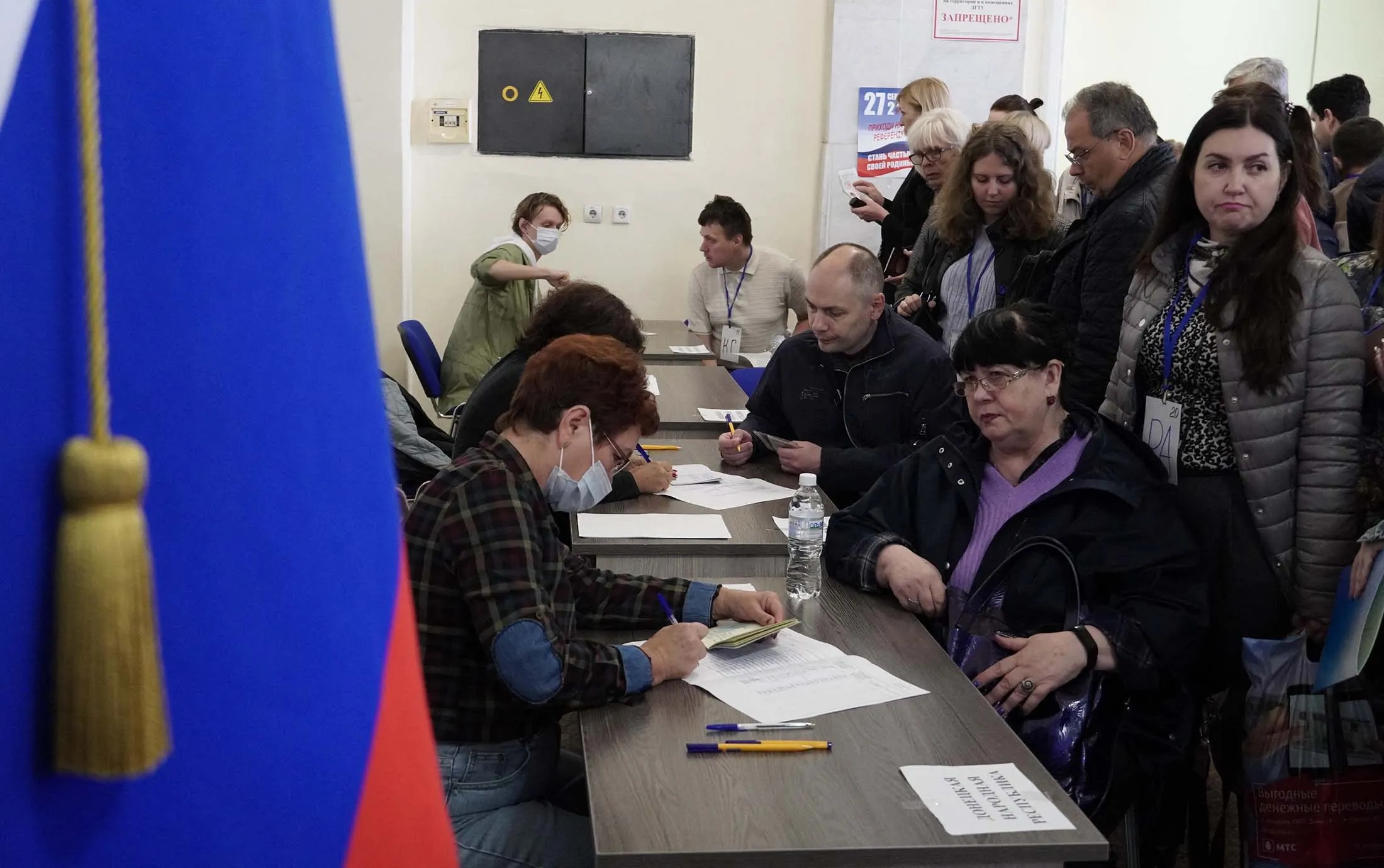 Refugees from Ukraine regions held by Russia arrive to vote for a referendum at a polling station in Rostov-on-Don on Sept.&nbsp;24.