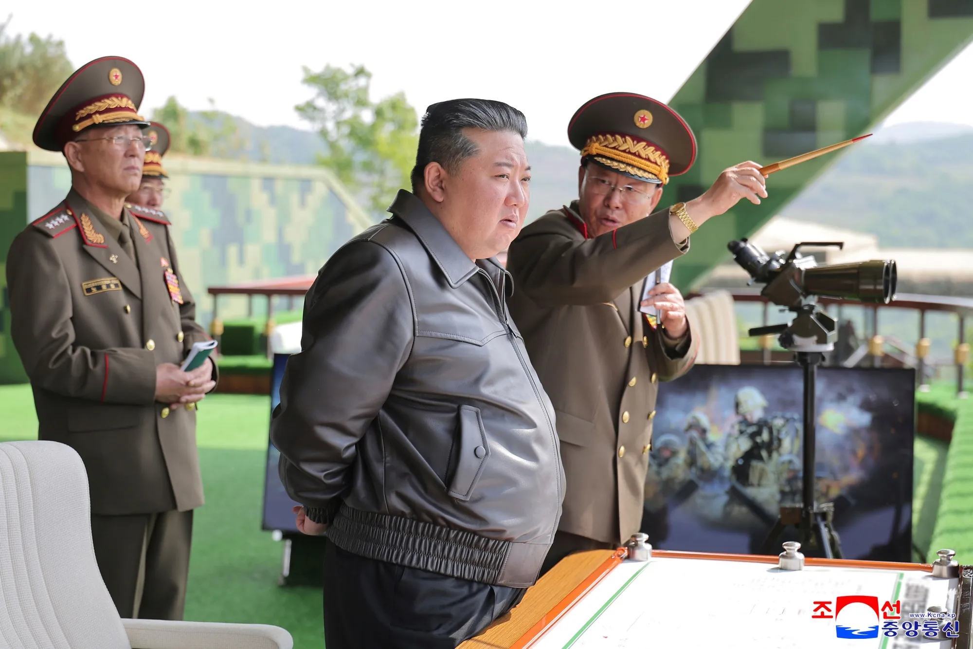 In this photo provided by the North Korean government, Kim Jong Un, center, inspects the military exercises in North Korea on May 13.