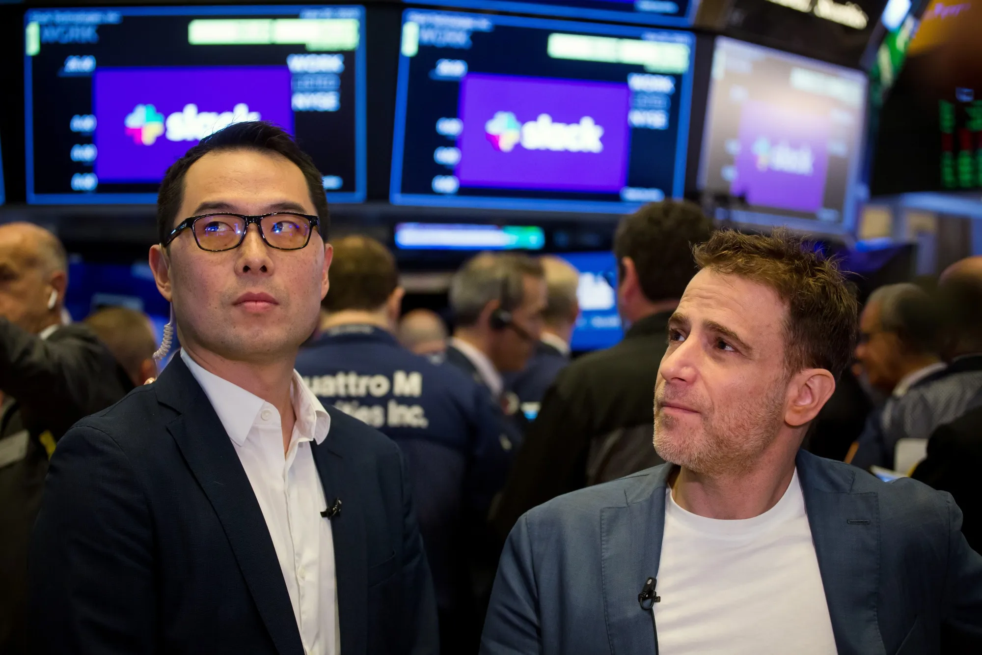 Allen Shim, chief financial officer of Slack Technologies Inc., left, and Stewart Butterfield, chief executive officer of Slack Technologies on the floor of the New York Stock Exchange (NYSE) during the company's initial public offering.
