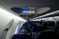 A Wi-Fi and fasten seat belts sign illuminated on a Delta Air Lines plane at Raleigh-Durham International Airport (RDU) in Morrisville, North Carolina, U.S