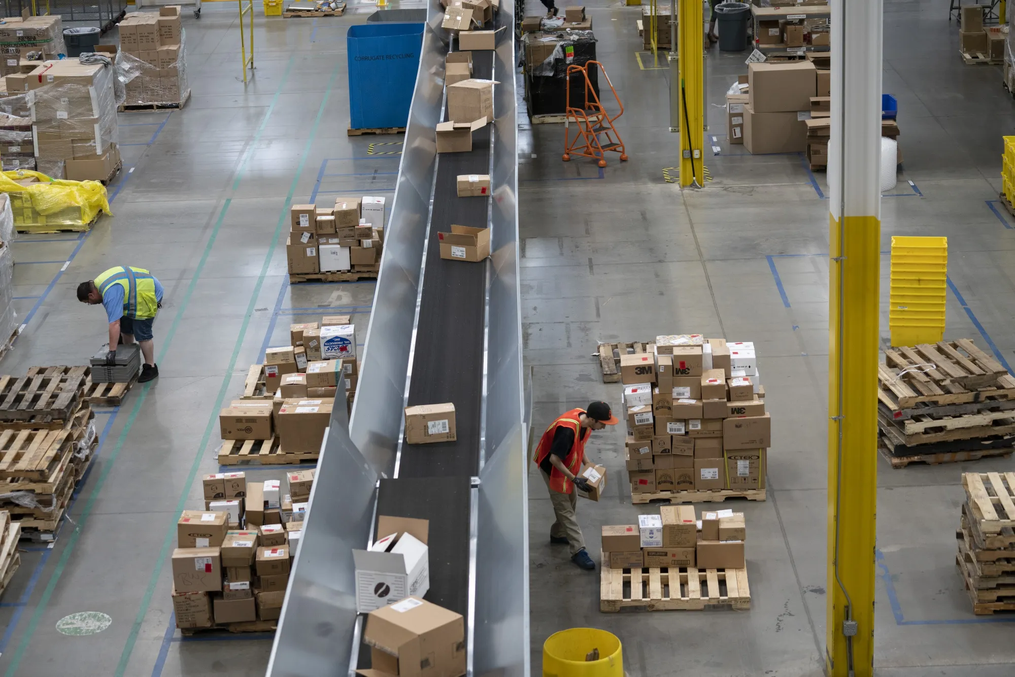 Employees work inside the Amazon.com Inc. fulfillment center in Baltimore, Maryland.
