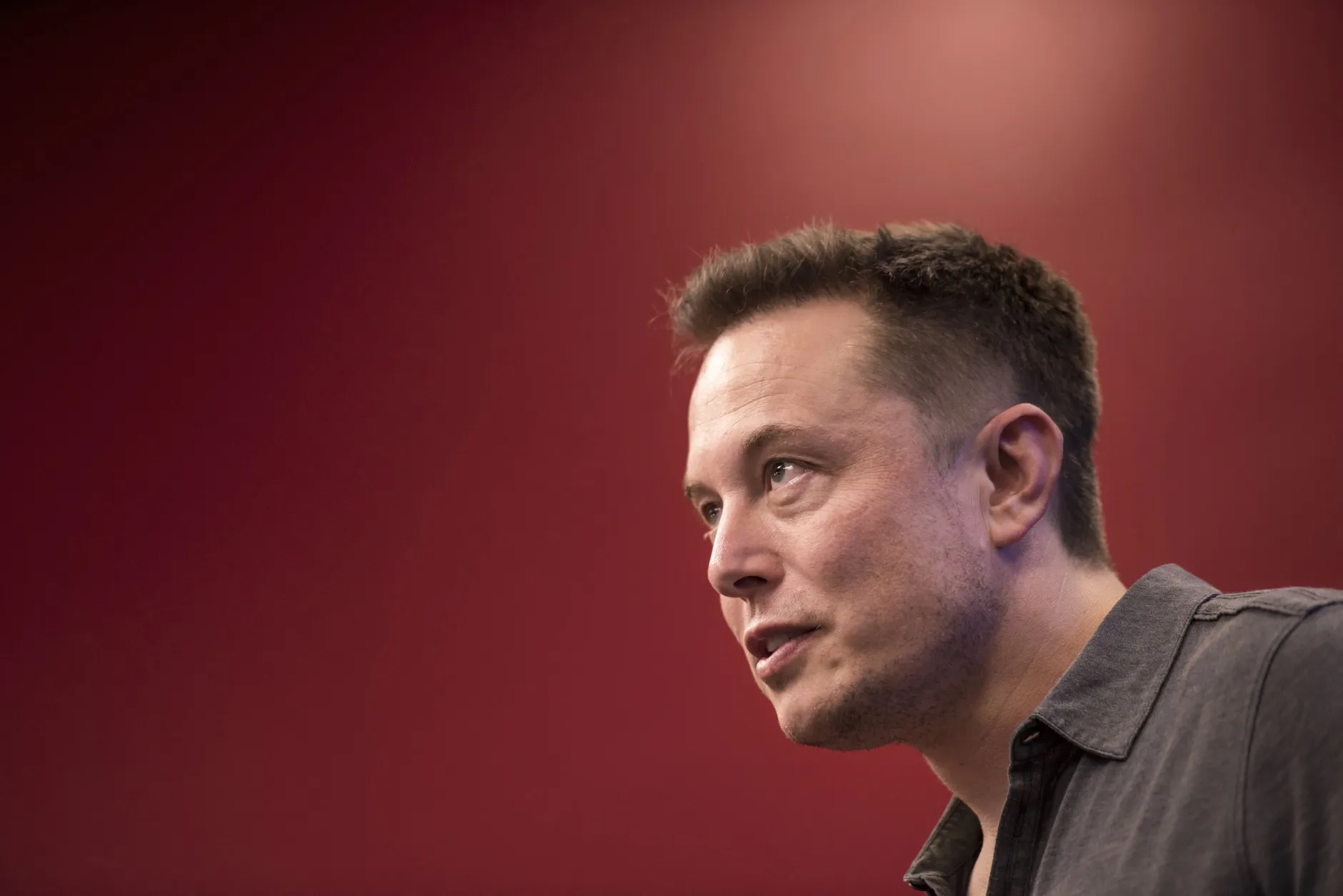 Elon Musk, chairman and chief executive officer of Tesla Motors, speaks during an event the company's headquarters in Palo Alto, California, U.S., on Wednesday, Oct. 14, 2015. Tesla Motors Inc. will begin rolling out the first version of its highly anticipated 'autopilot' features to owners of its all-electric Model S sedan Thursday. Autopilot is a step toward the vision of autonomous or self-driving cars, and includes features like automatic lane changing and the ability of the Model S to parallel park for you. Photographer: David Paul Morris/Bloomberg *** Local Caption *** Elon Musk
