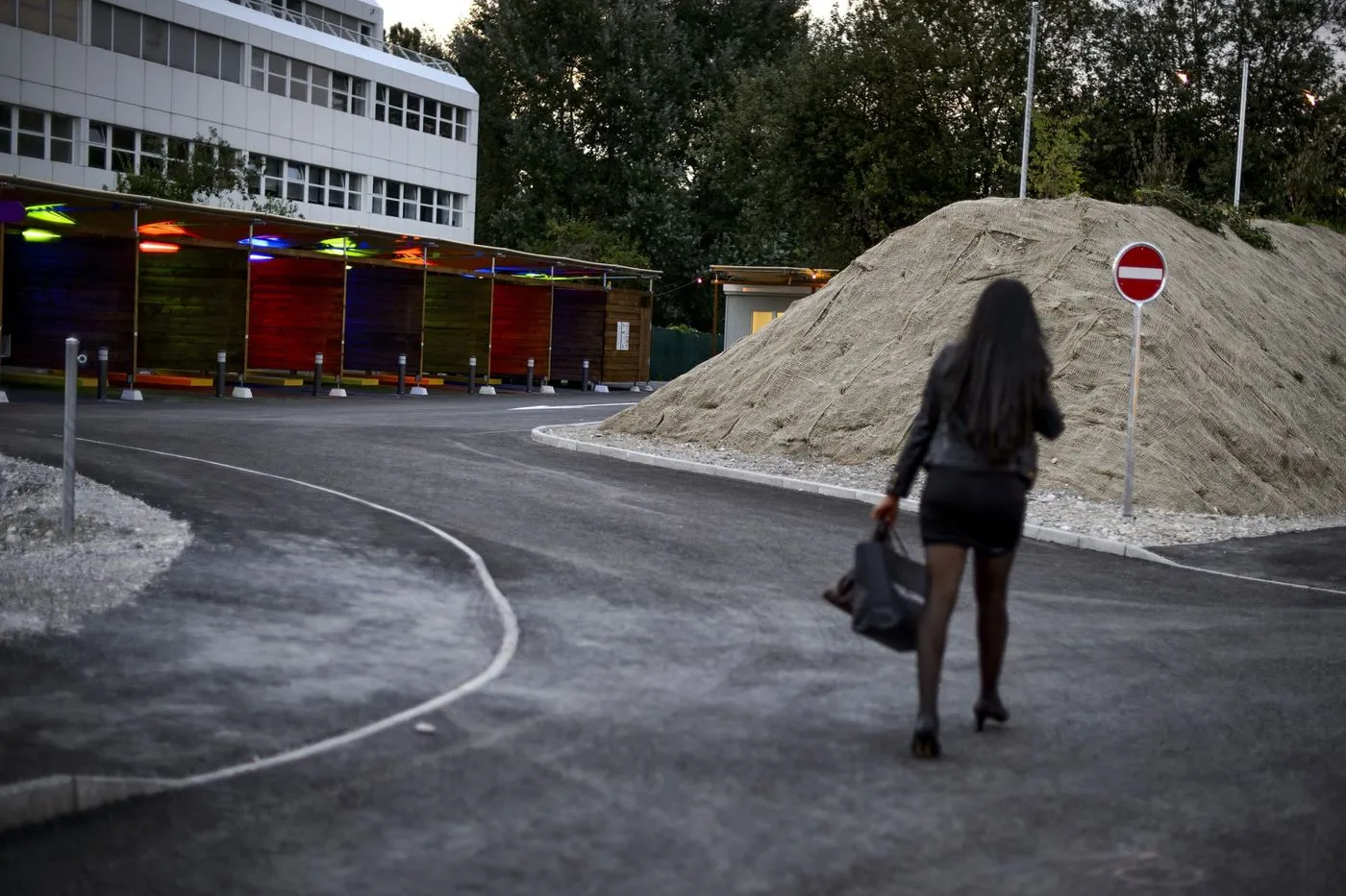 A prostitute walks past so-called ‘sex boxes’&nbsp;in Zurich.