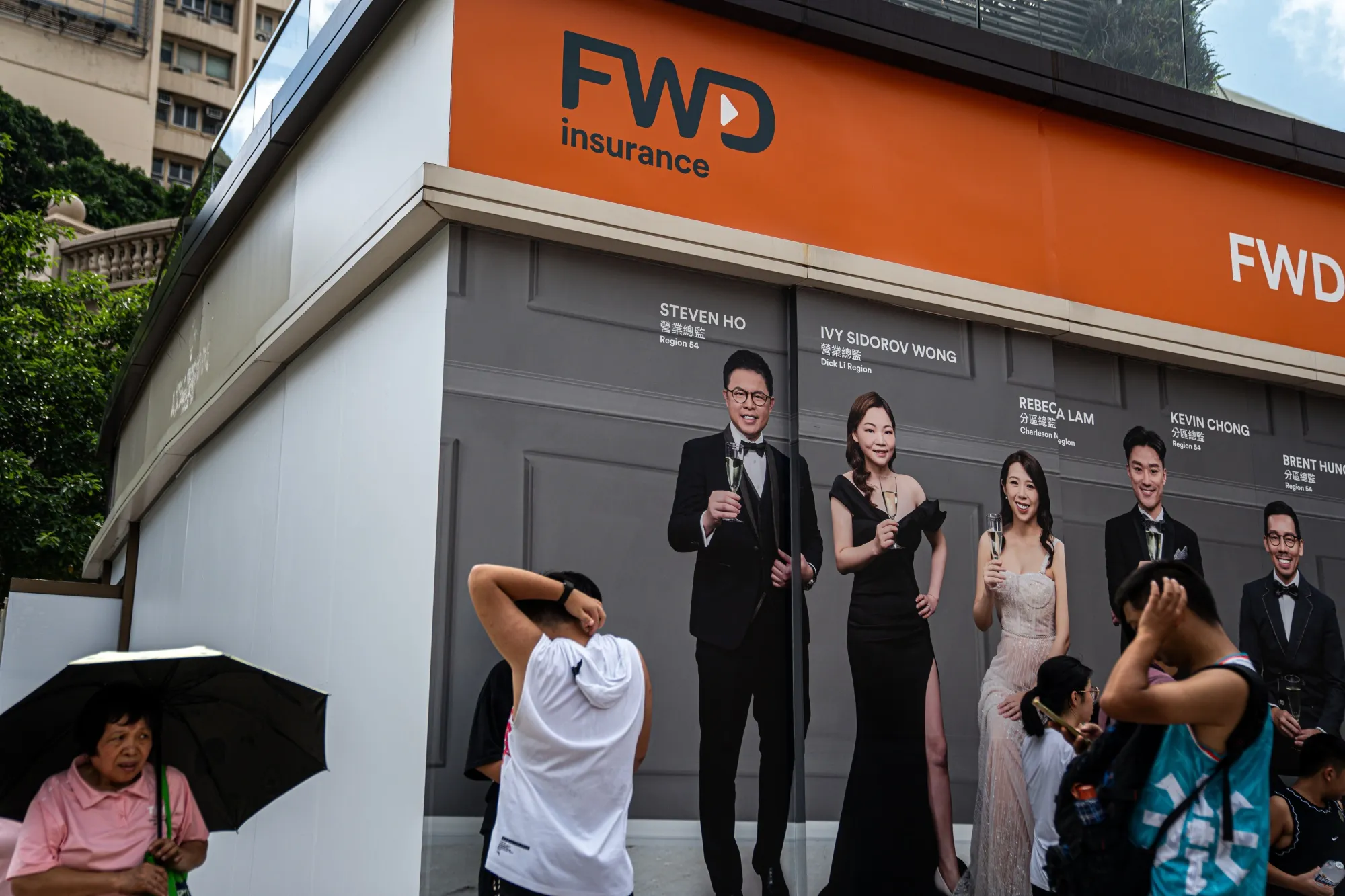 An advertisement for FWD Group Holdings Ltd. in Hong Kong.