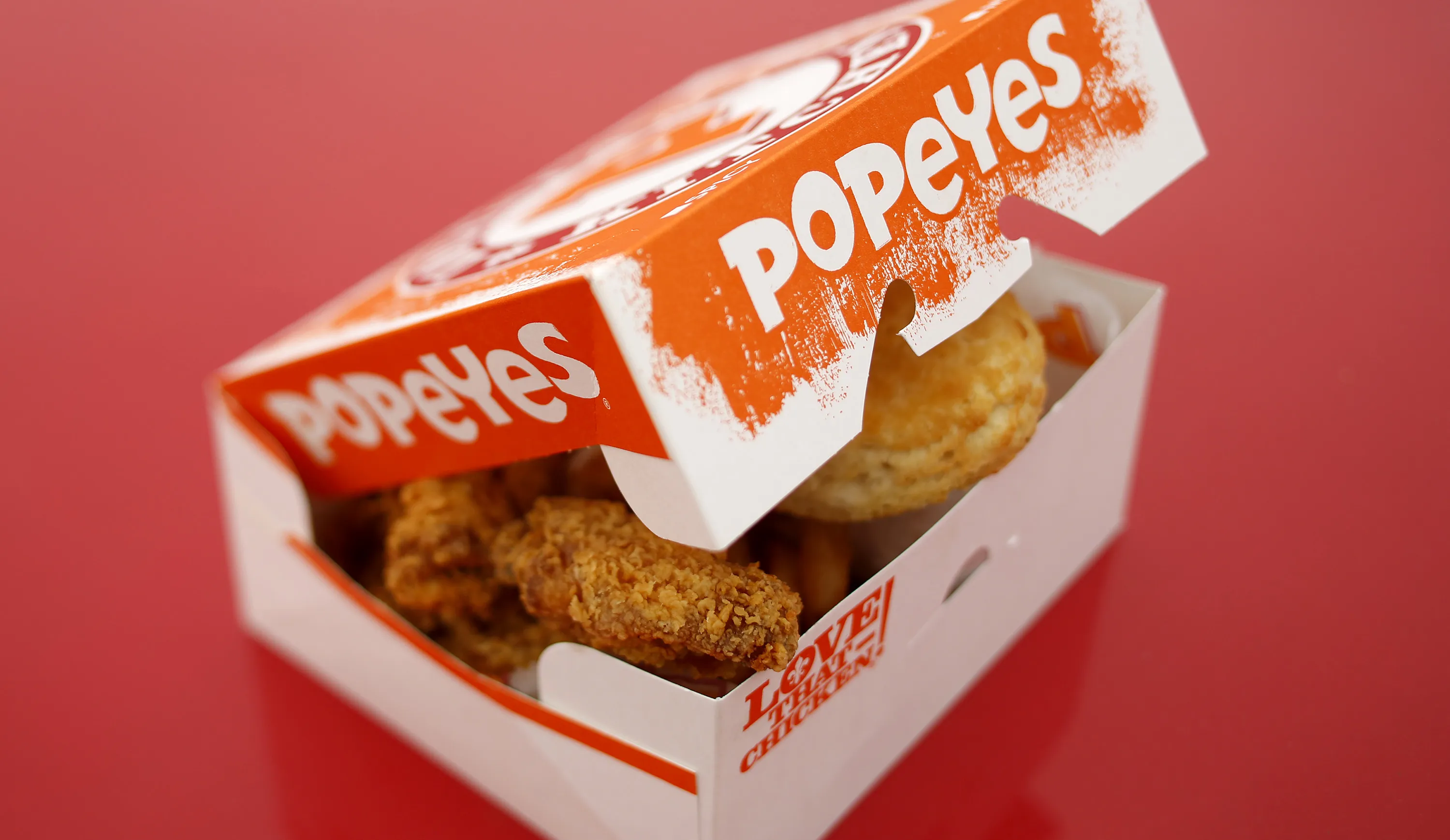 A box of fried chicken and biscuits is arranged for a photograph outside a Popeyes&nbsp;fast food restaurant in Jeffersonville, Indiana.