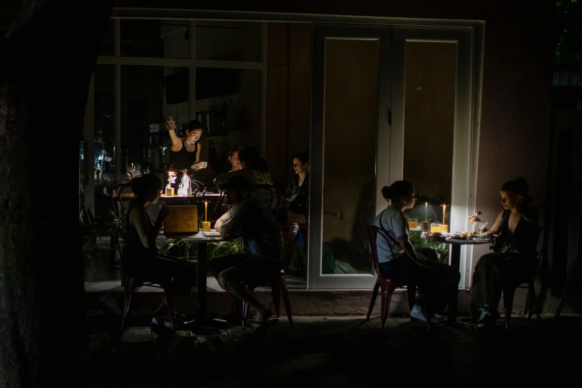 Customers dine&nbsp;during an island-wide power outage in San Juan, Puerto Rico, on April 16.&nbsp;