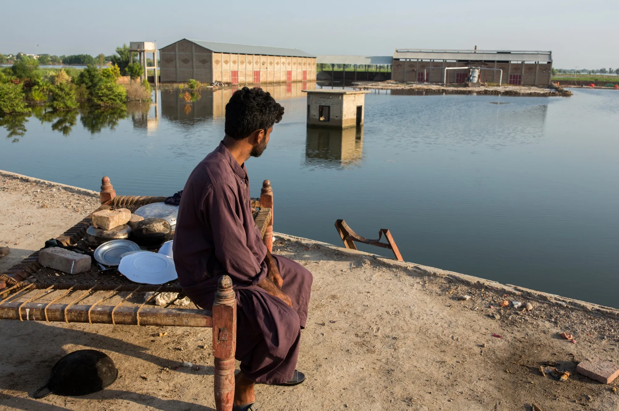 Flooded water surround the New Jhoolay Lal Cotton Ginners & Oil Mill in Sanghar district, Sindh province, Pakistan, on Saturday, Sept. 10, 2022. About 45% of the output from Pakistan, the worlds fifth-largest cotton producer, was destroyed by extreme flooding, forcing the country to spend $3 billion to import the raw material for its textile industry.