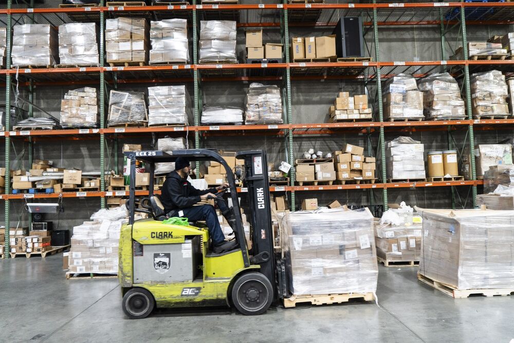 A worker operates a forklift at a fulfillment center in Elizabeth, New Jersey.