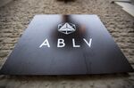 A sign stands at the entrance to the ABLV Bank AS offices in Riga, Latvia, on Wednesday, Dec. 11, 2013. The country of 2 million will become the 18th member of the euro area in January after transforming its finances and recovering from the world's deepest collapse in output four years ago.