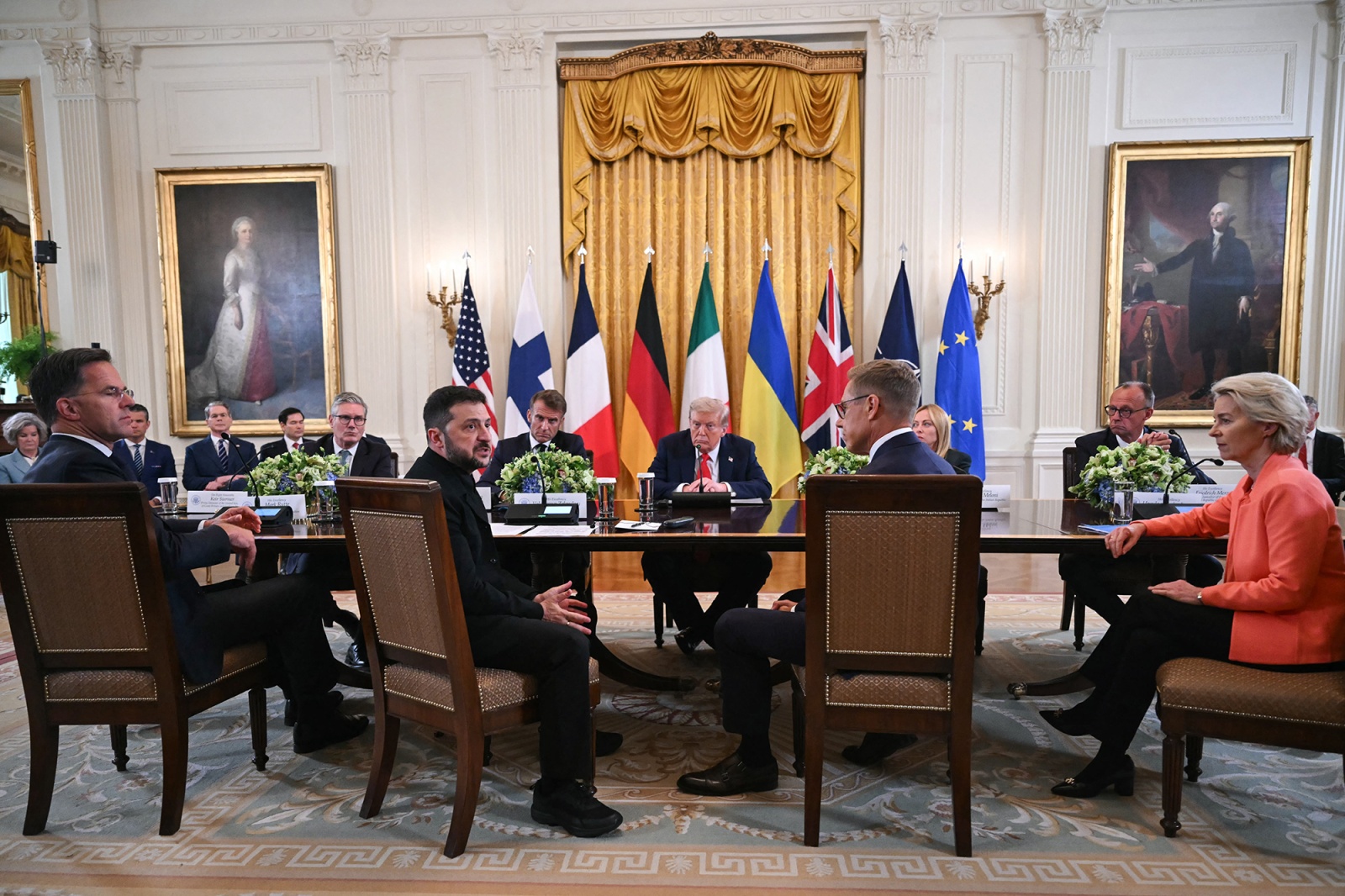 NATO Secretary-General Mark Rutte, from left, British Prime Minister Keir Starmer, Ukrainian President Volodymyr Zelensky US President Donald Trump, Finnish President Alexander Stubb, German Chancellor Friedrich Merz, and European Commission President Ursula von der Leyen participate in a meeting at the White House in Washington on Aug. 18.