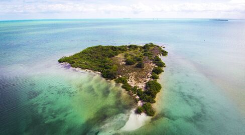 A seven-acre island for sale in Belize, offered by 7th Heaven Properties.