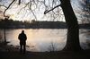 Man At Lake At Sunset