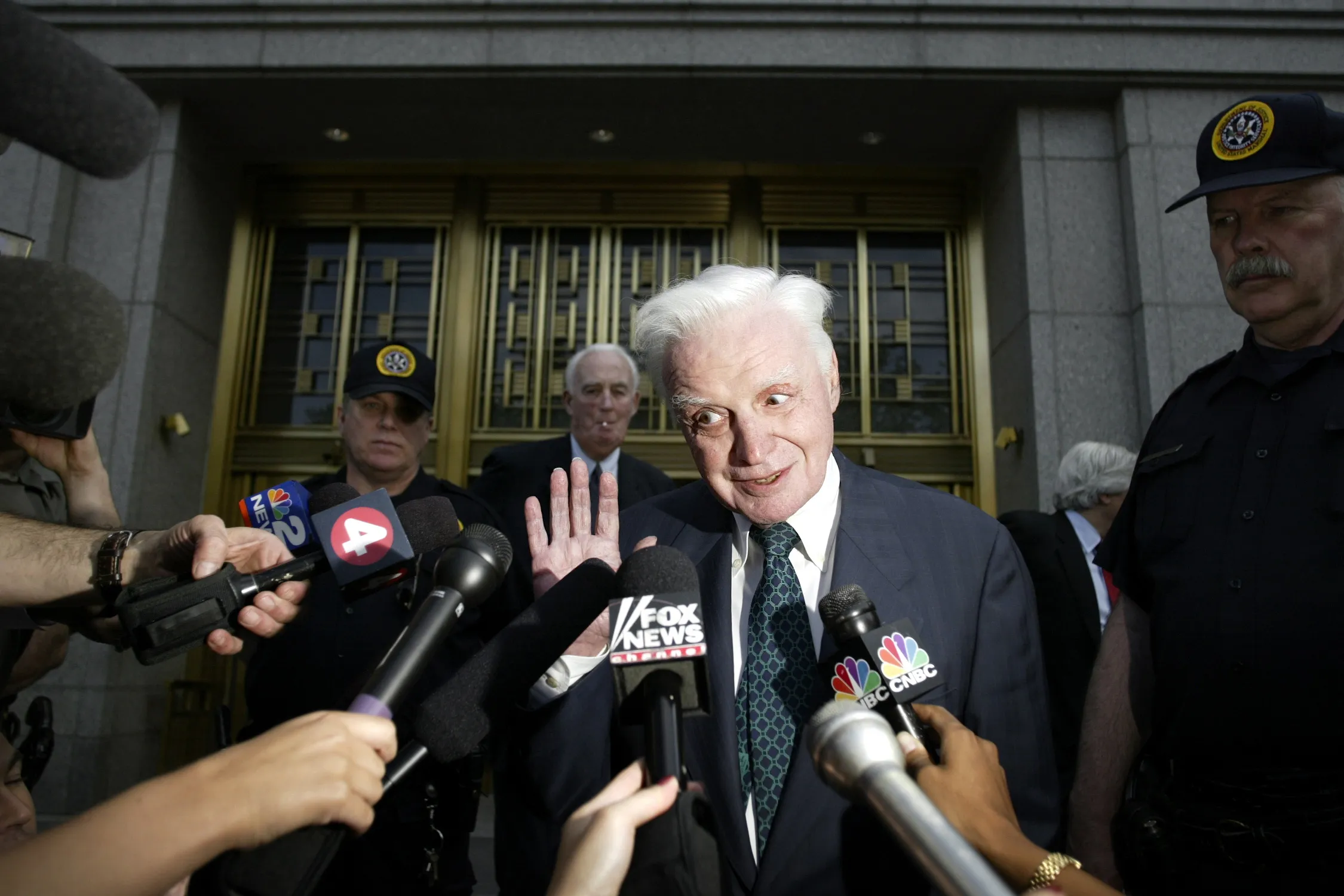 John Rigas exits Federal Court in New York in 2005.
