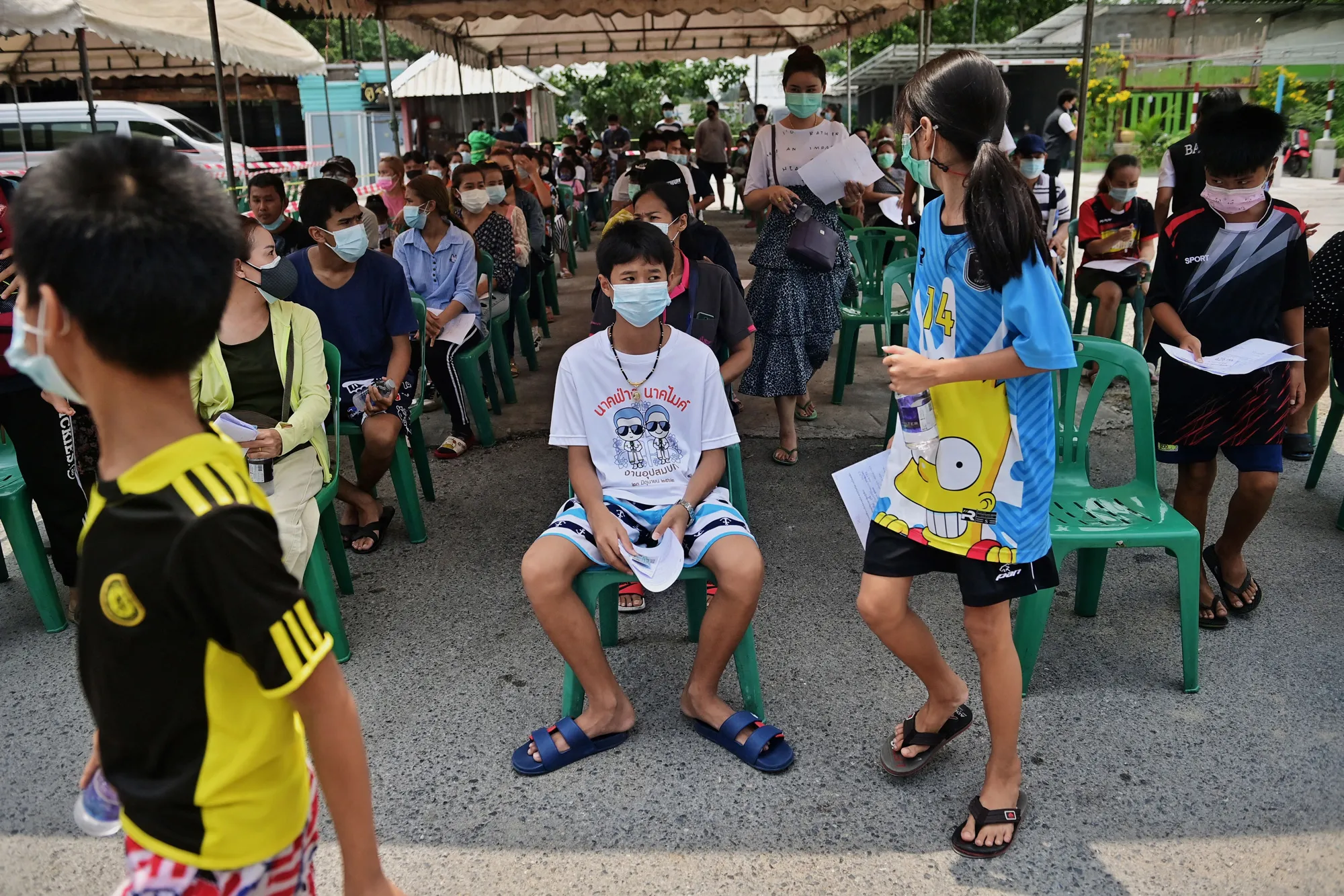 People receive Covid-19 tests at a mobile testing clinic in Bangkok, Thailand on May 4.