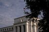 An American flag flies outside the Marriner S. Eccles Federal Reserve building in Washington, D.C., U.S., on Wednesday, July 31, 2019. The Federal Reserve is widely expected to lower interest rates by a quarter-point at its meeting that concludes Wednesday and leave the option open for additional moves despite demands by President Donald Trump for a "large" rate cut.