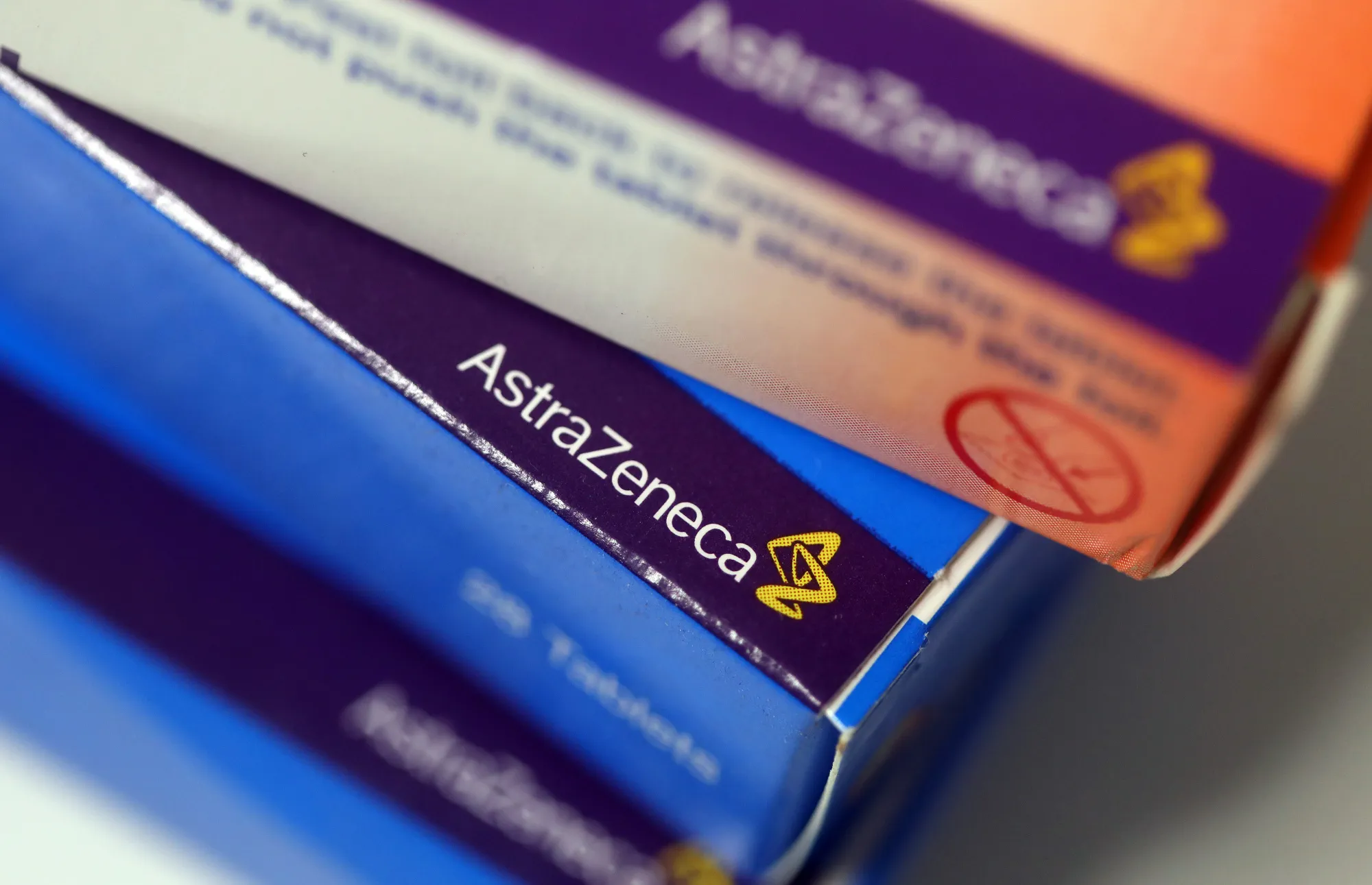 The AstraZeneca Plc logo sits on a packet of tablets on a pharmacy counter in this arranged photograph in London, U.K., on Thursday, Dec. 29, 2016. The rapid pace of innovation among drugmakers may continue to be overshadowed by broader investment themes, such as the switch away from defensive stocks into more cyclical industries, during 2017, according to Bloomberg Intelligence.