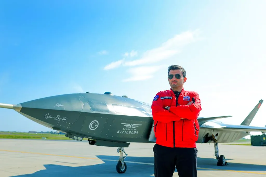 Selcuk Bayraktar in front of Turkey’s newly developed Kizilelma drone fighter.