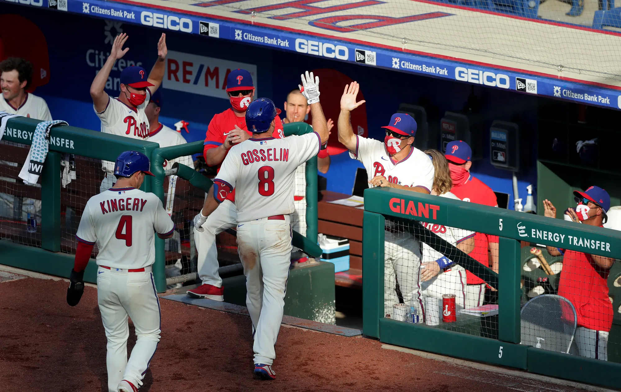 Phil Gosselin&nbsp;of the Philadelphia Phillies high fives manager Joe Girardi after hitting a two-run home run in the sixth inning during a game against the Miami Marlins in Philadelphia on July 25.&nbsp;