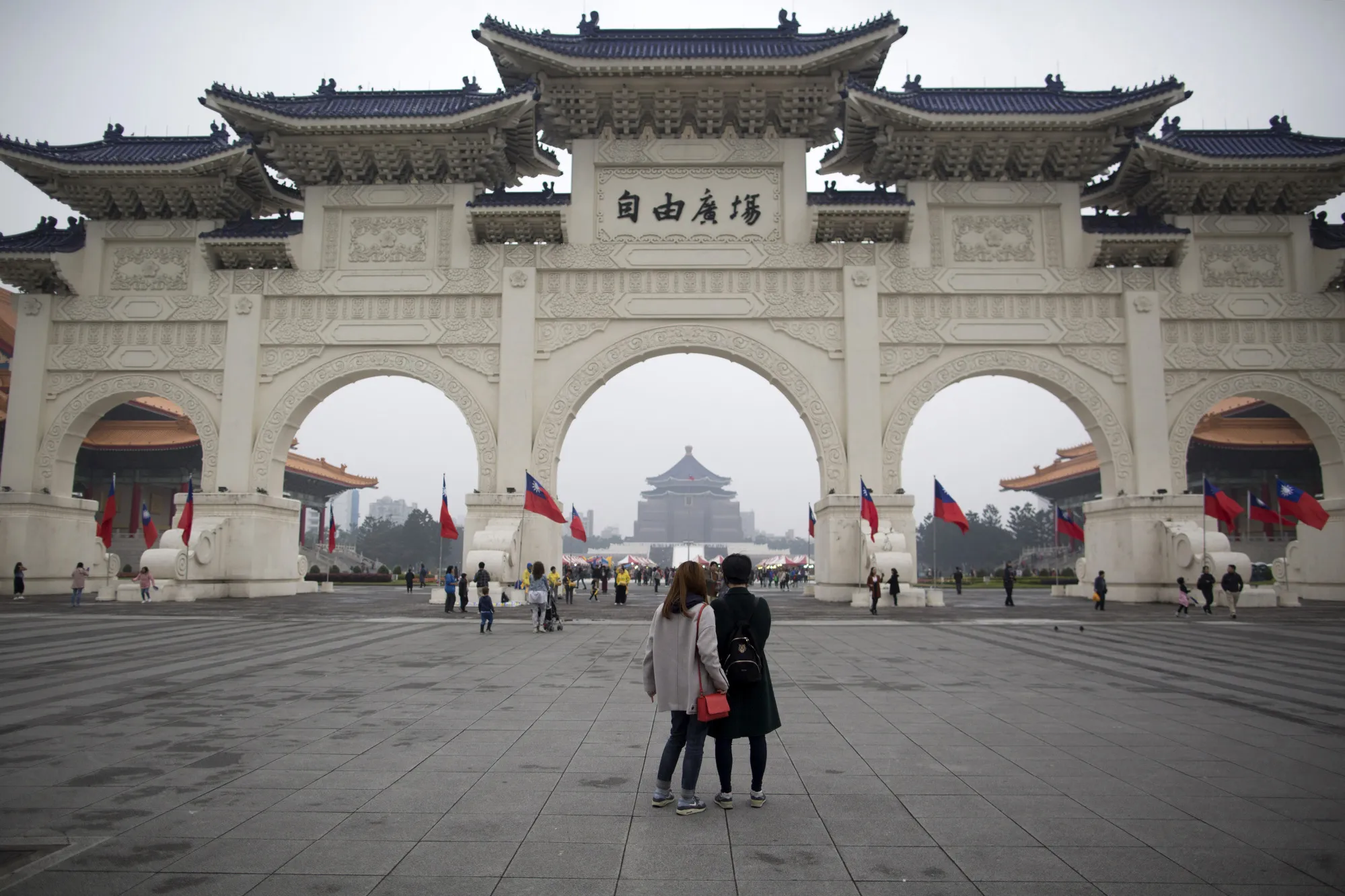 Visitors stand at Liberty Square near the Chiang Kai-shek Memorial Hall&nbsp;in Taipei, Taiwan.