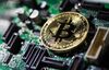 A coin representing Bitcoin cryptocurrency.