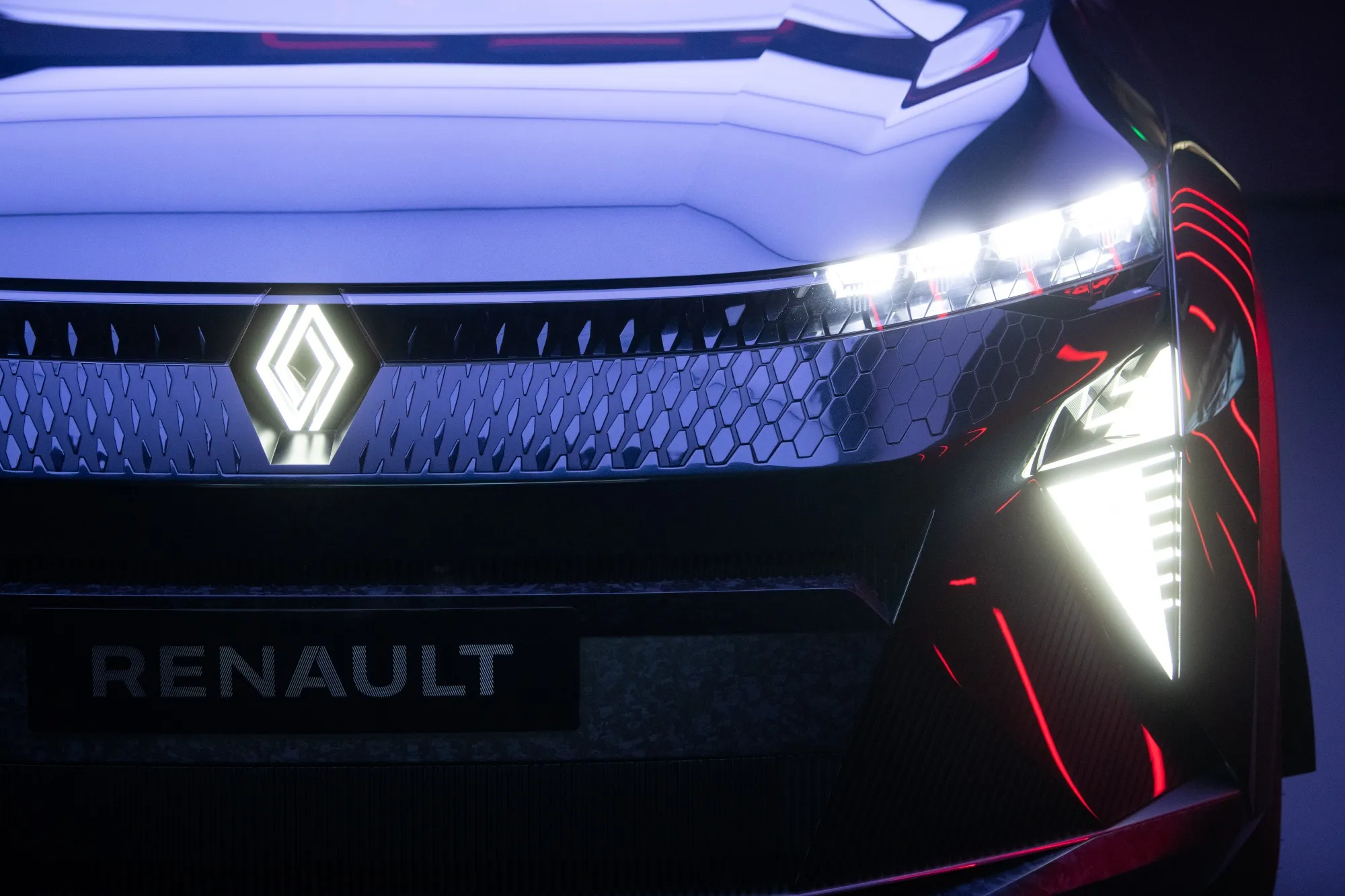 The badge of Renault SA on the front grille of a Scenic Vision hybrid concept vehicle.
