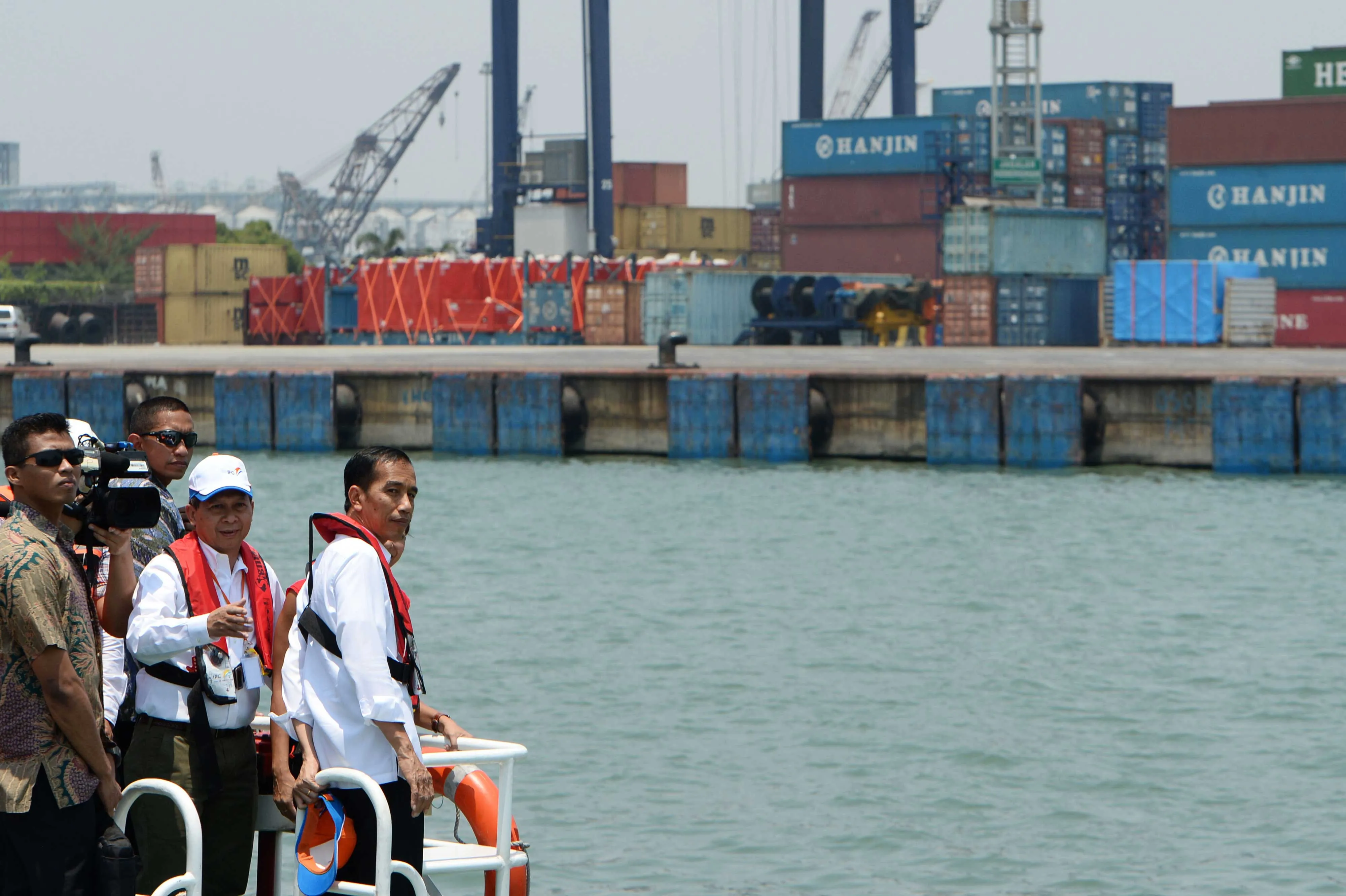 Indonesian President Joko Widodo, farthest right, takes a post-election tour of his nation's ports.

