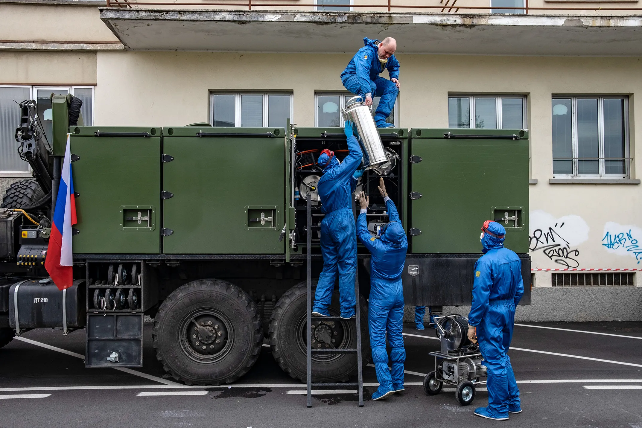 Soldiers from the Russian military pack equipment following their full disinfection of the Foundation of Ponte S. Pietro nursing home in Ponte San Pietro, near Bergamo, Italy, on April 1.