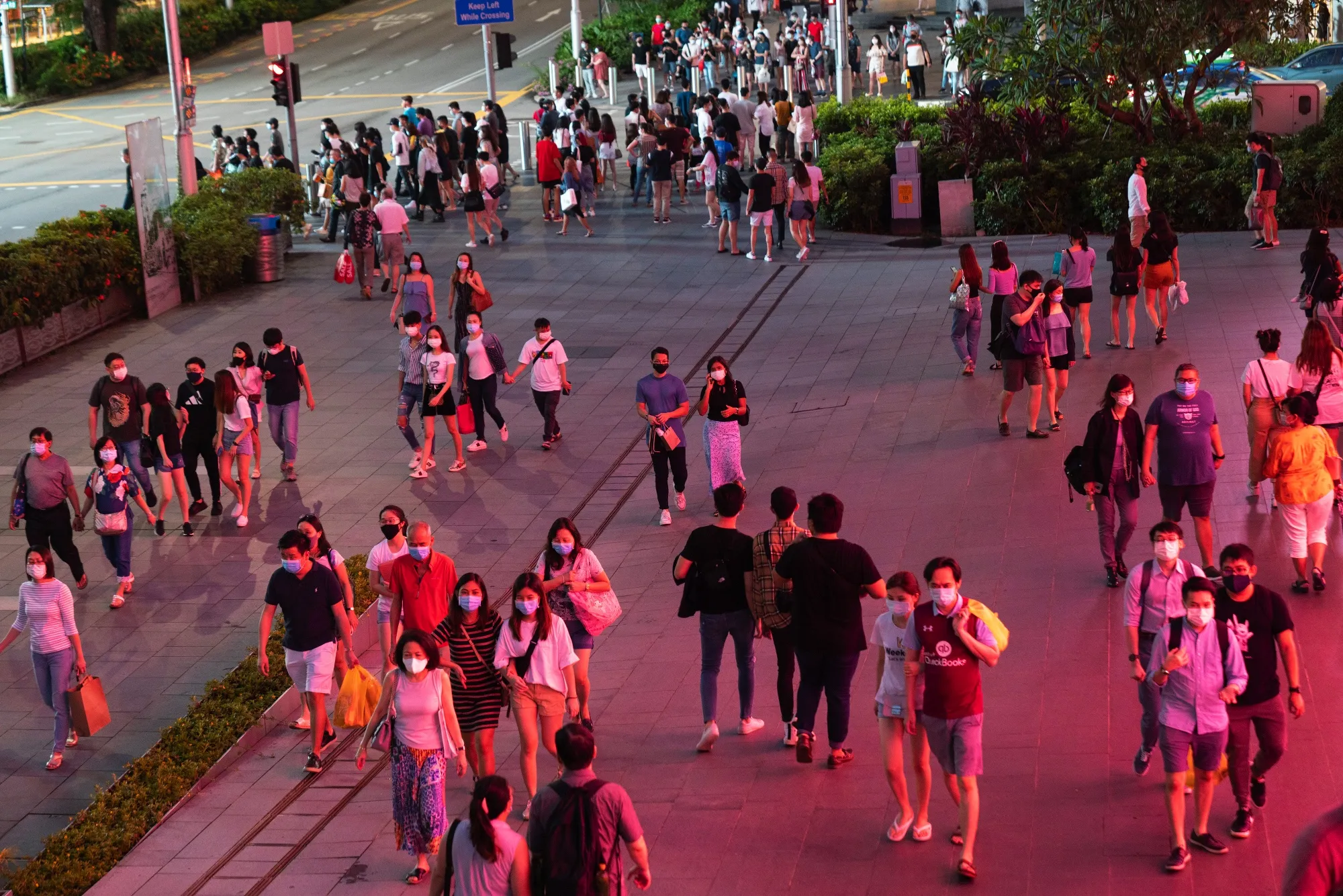 Pedestrians&nbsp;pass along Orchard Road in Singapore.