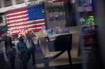 Times Square is reflected in the window of the Nasdaq MarketSite in New York, US, on Friday, June 9, 2023.