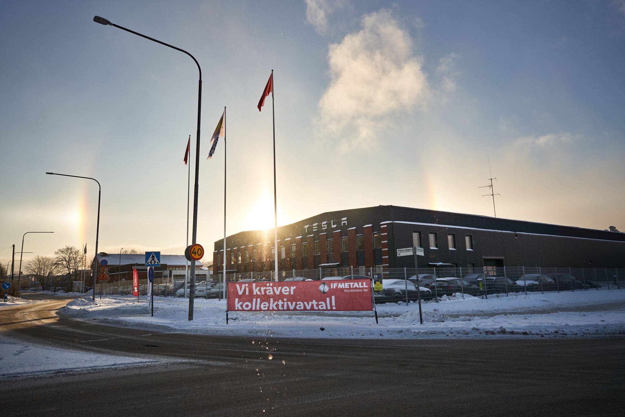 A banner from IF Metall union reading "We Demand a Collective Agreement" during a labor protest outside the Tesla Inc. service center in Segeltorp, Sweden, on Dec. 5.