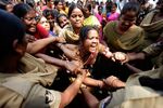 In this Feb. 28, 2011, photo, police detain women activists protesting against alleged harassments by microfinance companies in Hyderabad, India