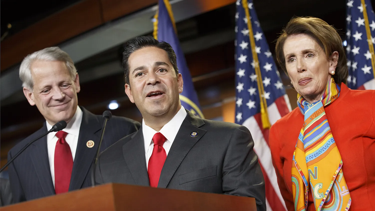 Rep. Ben Ray Lujan, D-N.M., center, thanks House Minority Leader Nancy Pelosi, D-Calif., right, after she announced he will take over as head of the Democratic Congressional Campaign Committee from Rep. Steve Israel, D-N.Y., left, during a news conference at the Capitol in Washington, Monday, Nov. 17, 2014.
