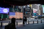 An American flag near the Nasdaq MarketSite in New York, U.S., on Friday, Jan. 21, 2022.