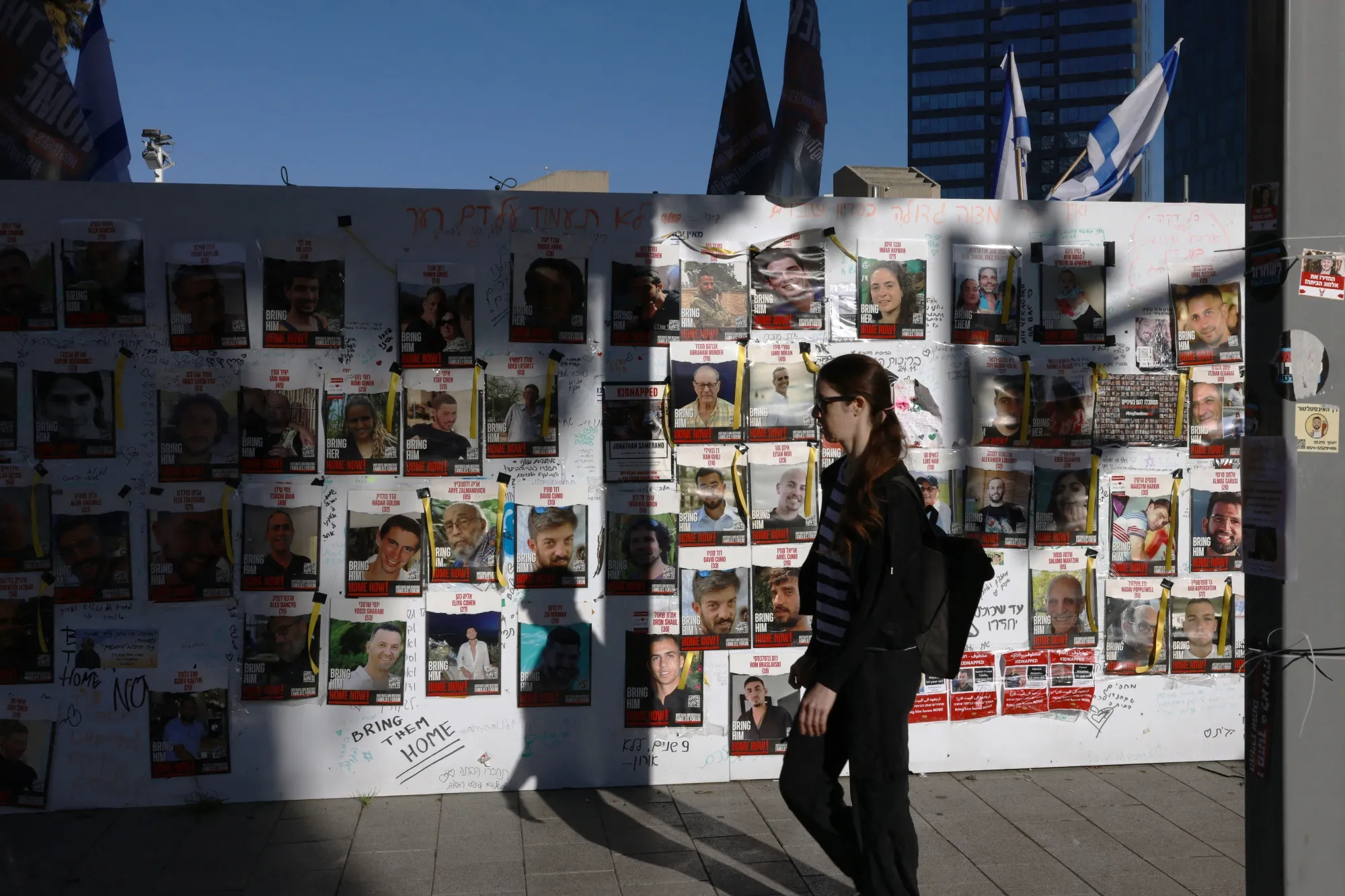 Israeli hostages posted on a wall in Tel Aviv, on Dec.&nbsp;17.&nbsp;