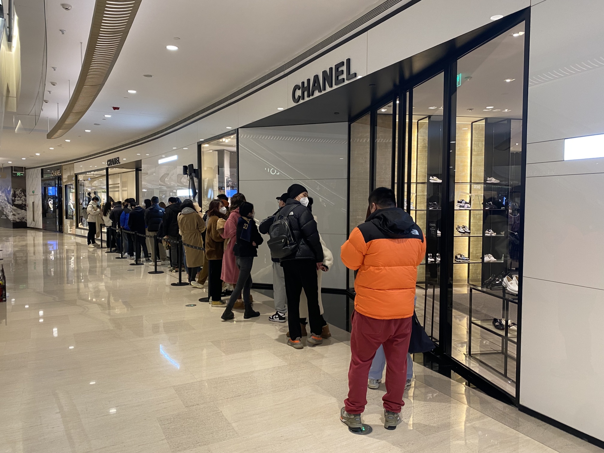 Shoppers Queue Outside Chanel Store On Editorial Stock Photo