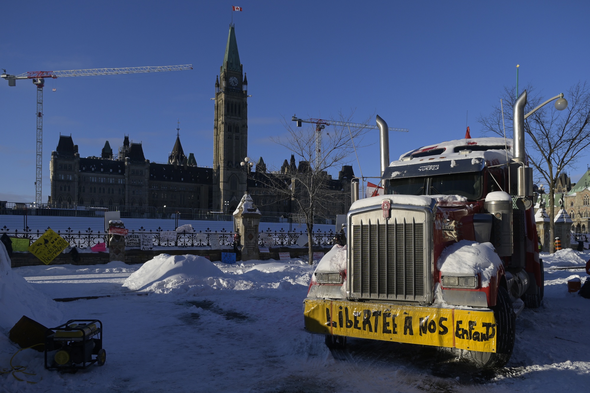 A truck sits parked in front of the parliament buildings in Ottawa on Friday, before police cleared the streets after a three-week occupation.