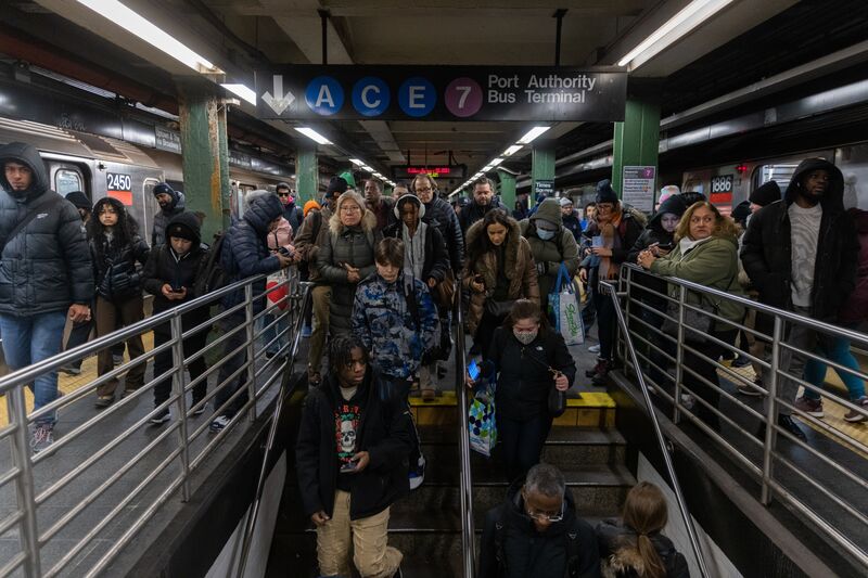 Commuters at the Times Square subway station in New York, US, on Friday, Jan. 5, 2024.  