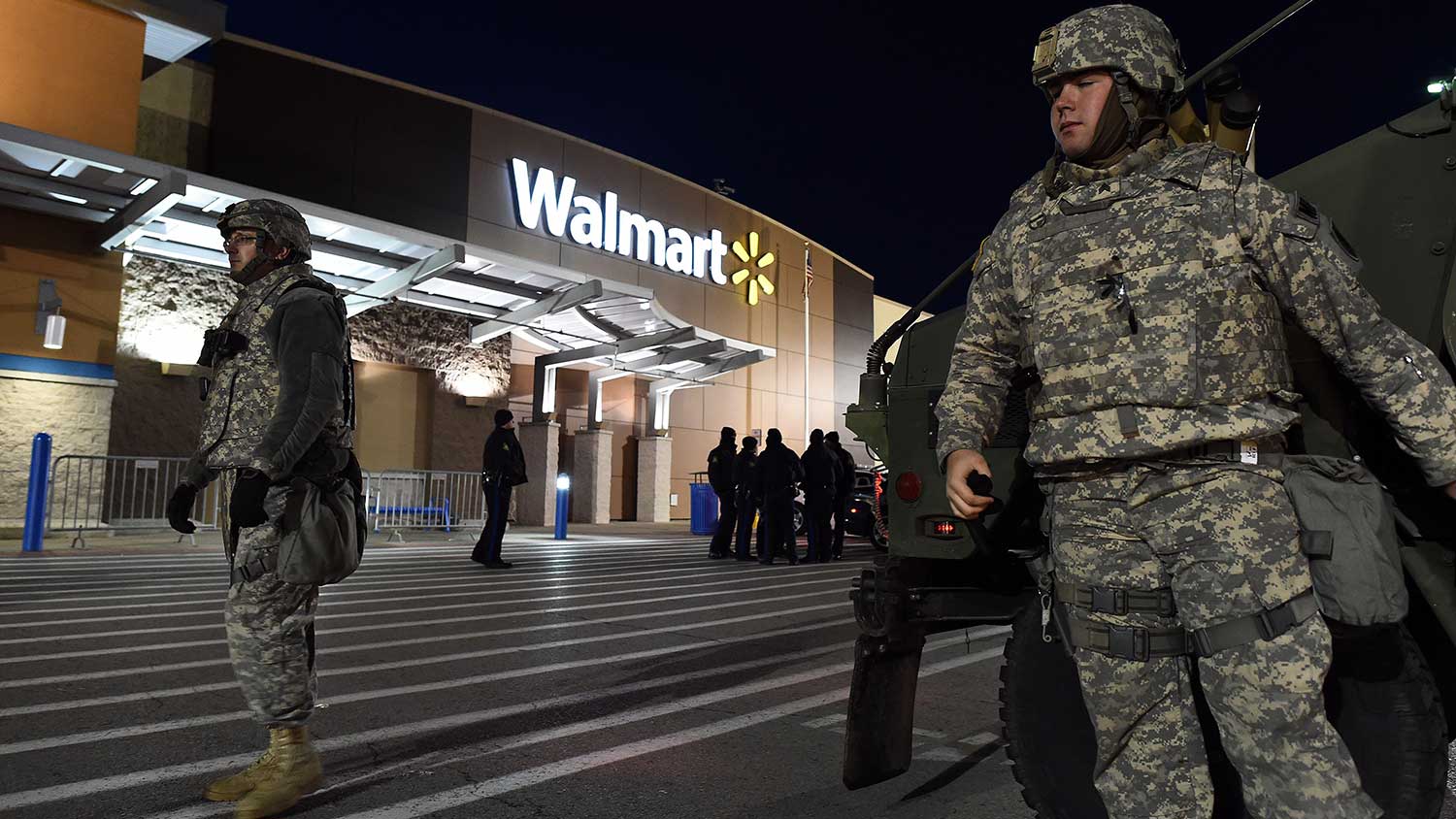 National Guard troopers and police officers keep vigil in front of a Wal-Mart in Ferguson, Missouri, on November 27, 2014.
