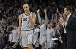San Antonio Spurs guard Manu Ginobili (20) pumps his fist after hitting the winning shot in the final seconds of the team's NBA basketball game against the Boston Celtics, Friday, Dec. 8, 2017, in San Antonio. The four-time NBA champion with the San Antonio Spurs is one of the headliners for Saturday night’s enshrinement ceremony in Springfield, Massachusetts. (AP Photo/Eric Gay, File)