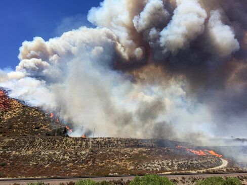 The Blue Cut fire throws up large plume of smoke shortly after it broke out in the Cajon Pass.