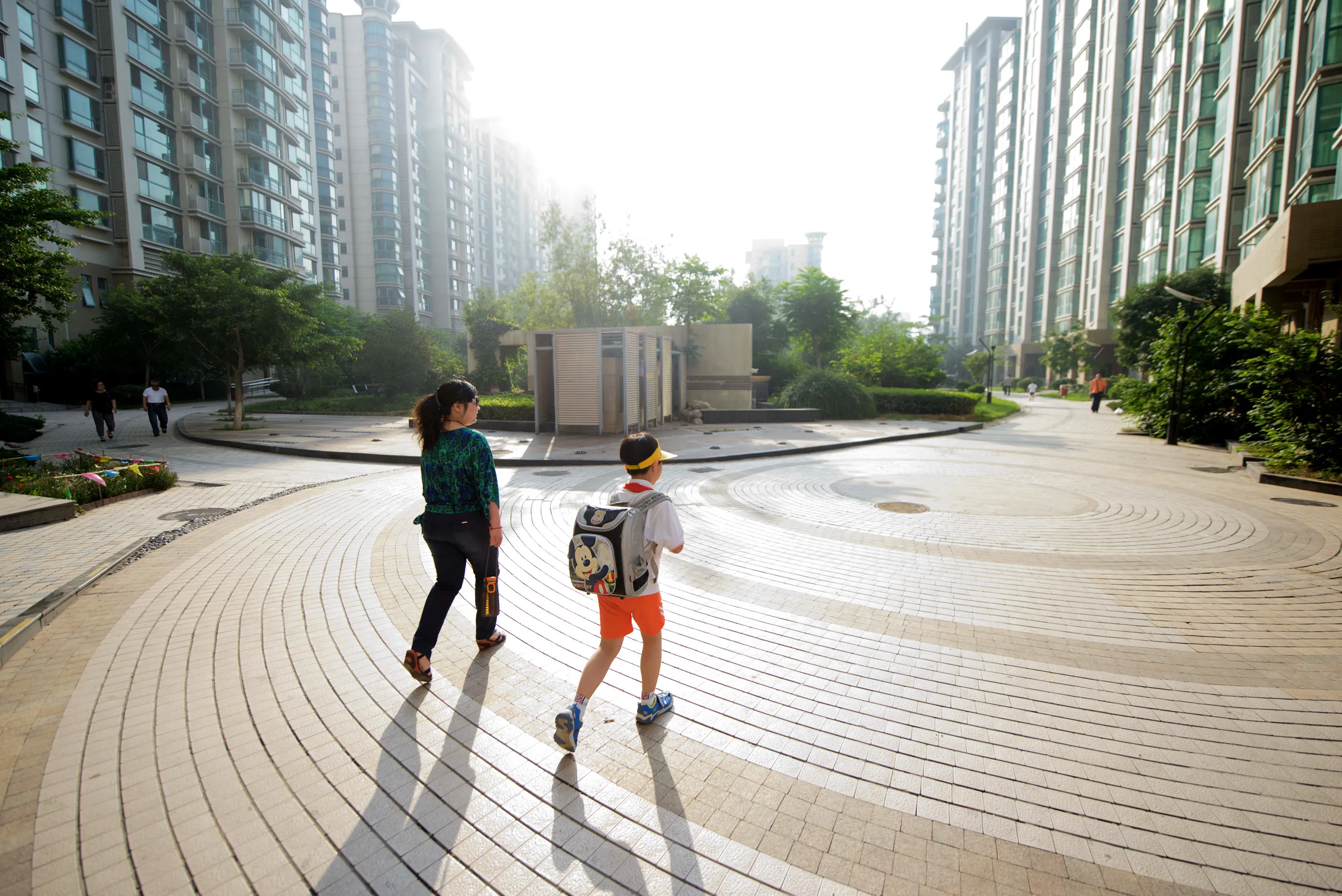 A mother and child in Beijing. Photographer: Ed Jones/AFP via Getty Images