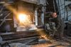 A worker attends to a furnace during steel manufacture at the Turboatom OJSC plant in Kharkiv, Ukraine, on Friday, June 22, 2018. Turboatom OJSC is a power machine building complex, specializing in the production of steam turbines for electric power stations, gas, hydraulic and small steam turbines and hydraulic shutters of different types.