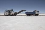A machine loads soil into a truck during the construction at the Uyuni salt flat in Bolivia.