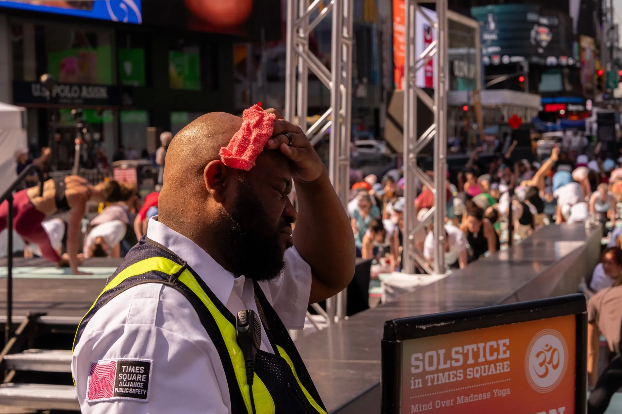 A man wipes away sweat in Times Square during a June 2024 heat wave.