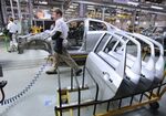 Door panels sit in a rack before fitting to Lada Vesta automobiles on the assembly line at the Izhevsk Automobile Plant, operated by AvtoVAZ OAO, in Ishevsk, Russia, on Thursday, April 14, 2016. AvtoVAZ's Lada is Russia's largest car brand and best-selling nameplate.
